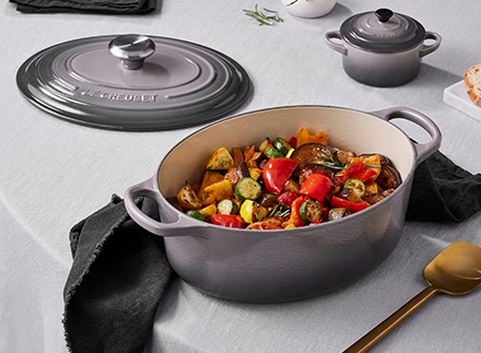oyster gray dutch oven with light green kitchen towel